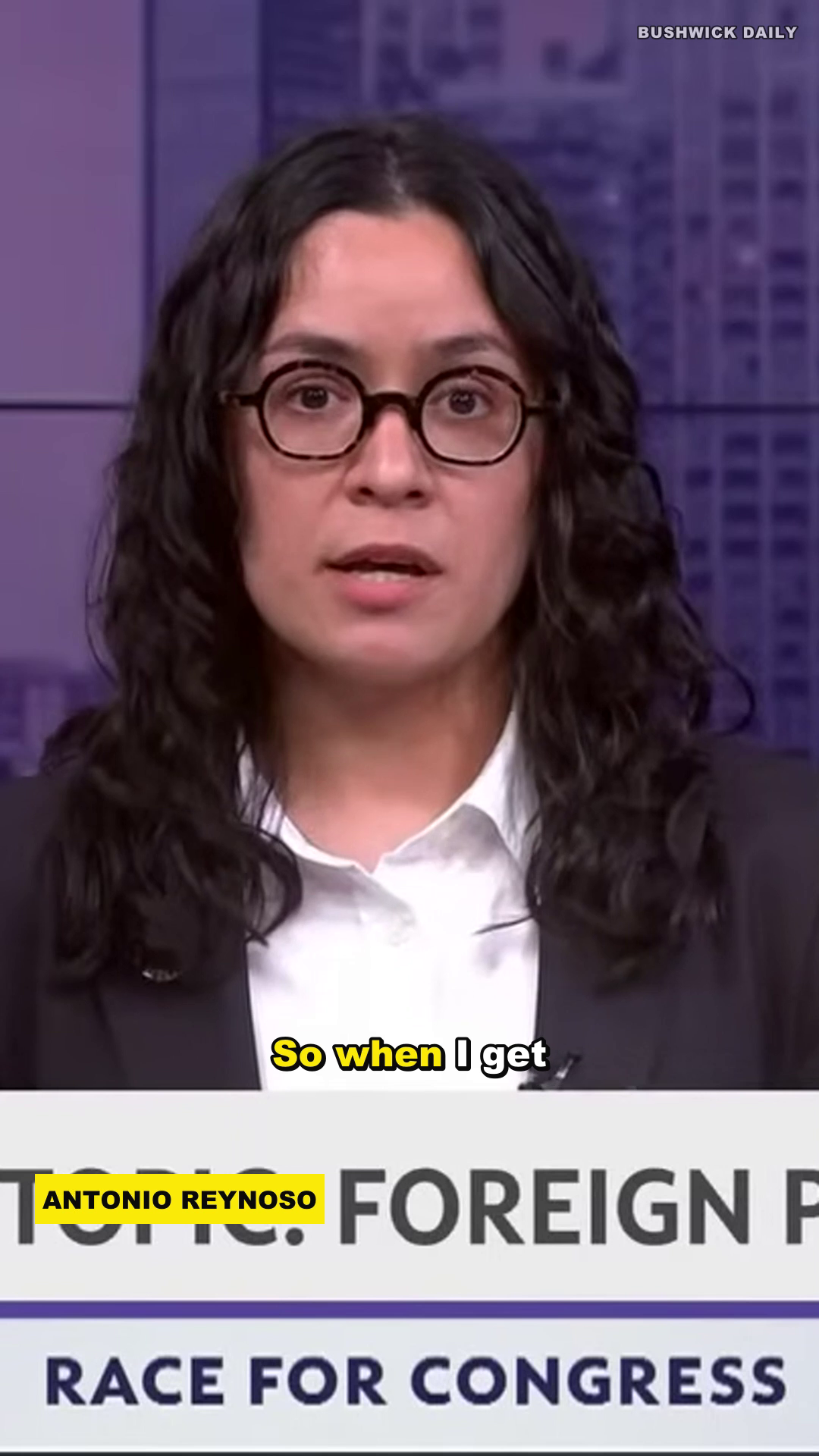Finished 9:16 vertical render: karaoke caption with active-word highlight, ANTONIO REYNOSO lower-third, FOREIGN POLICY topic banner, BUSHWICK DAILY watermark.