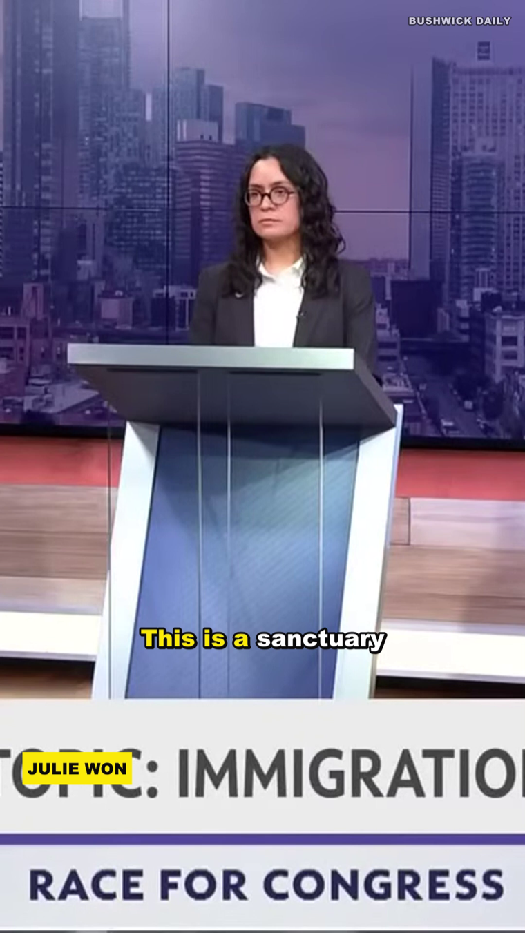 A finished 9:16 captioned civic clip: the karaoke caption &ldquo;This is a sanctuary&rdquo; with the active word highlighted yellow, a JULIE WON lower-third, a TOPIC: IMMIGRATION banner, a RACE FOR CONGRESS bar and a BUSHWICK DAILY watermark — rendered with ffmpeg at zero render cost.